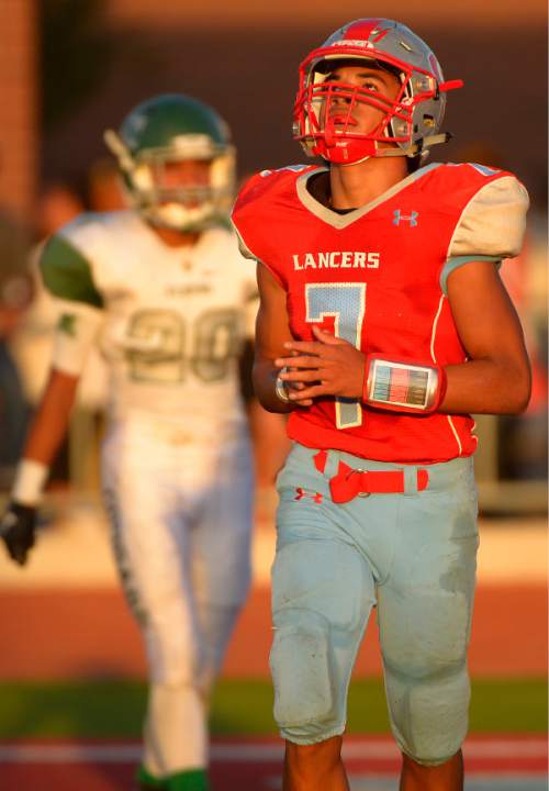 Leah Hogsten  |  The Salt Lake Tribune
Granger's Sione Houma celebrates his touchdown.Kearns High School leads Granger High School 28-7 during their game at Granger, August 28, 2015.