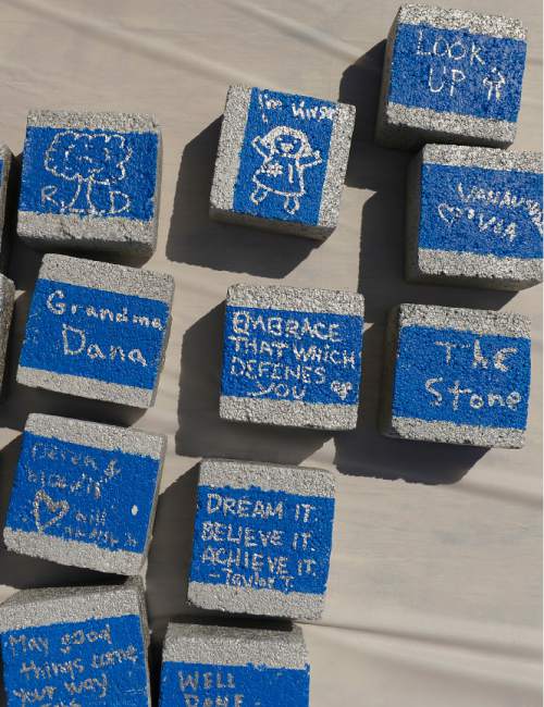 Leah Hogsten  |  The Salt Lake Tribune
The public was invited to pen their names and inspirational messages on bricks that will be used to build the new facility. The Volunteers of America broke ground on a new 30-bed shelter at 888 South and 400 West for teens and young adults, August 22, 2015