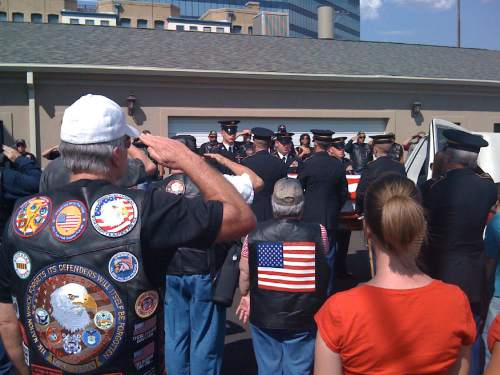 |  Tribune File Photo

A crowd watches as a flag-draped casket, carrying the remains of Utah soldier Kurt Curtiss, is lifted from a hearse to the Russon Brothers Mortuary in Salt Lake City, Sept. 4 2009.