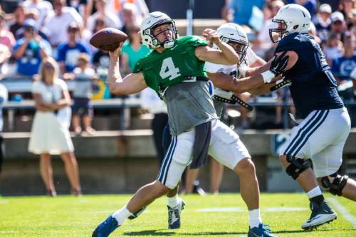 Chris Detrick  |  The Salt Lake Tribune
Brigham Young Cougars quarterback Taysom Hill (4) passes the ball during a scrimmage at LaVell Edwards Stadium Saturday August 15, 2015.