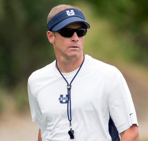 Steve Griffin  |  The Salt Lake Tribune

USU head coach Matt Wells watches play during opening day of Utah State University football practice in Logan, Friday, August 7, 2015.  l