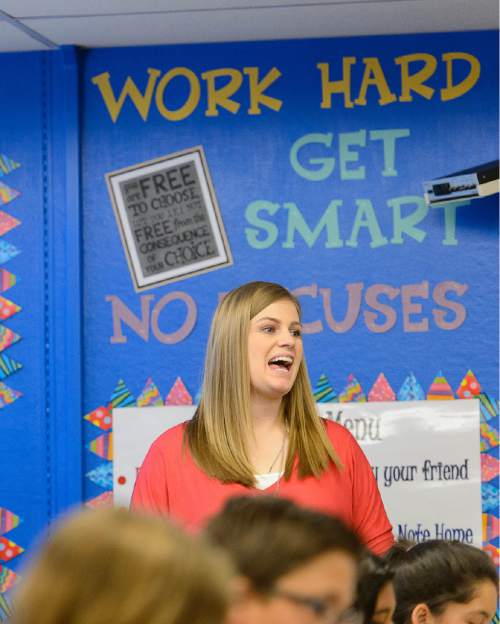 Trent Nelson  |  The Salt Lake Tribune
Eleisha Boehm, a teacher at Lincoln Elementary School in Salt Lake City, works with sixth-graders, Friday August 28, 2015. The second year of SAGE scores for Utah schools will be released on Monday, August 31. Lincoln Elementary School saw the largest improvement on SAGE scores among the schools in Salt Lake City District.