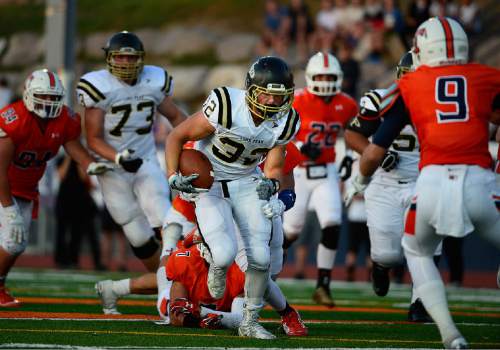 Scott Sommerdorf   |  The Salt Lake Tribune
Lone Peak RB Britton Bettridge found large holes to run through during first half play. Lone Peak led Timpview 14-7 at the half in Provo, Friday, August 28, 2015.