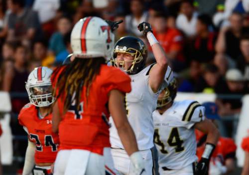 Scott Sommerdorf   |  The Salt Lake Tribune
Lone Peak WR Tyson Doman yells after making a key third down catch to keep a drive going during first half play. Lone Peak led Timpview 14-7 at the half in Provo, Friday, August 28, 2015.