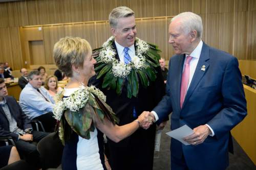 Francisco Kjolseth | The Salt Lake Tribune
John W. Huber, center, joined by his wife Lori, are greeted by Senator Orrin Hatch following Huber's swearing in ceremony as U.S. Attorney for Utah at the new Federal Courthouse in Salt Lake City on Monday, Aug. 31, 2015.  John W. Huber and his wife Lori were presented with Tongan flower Lei's made by Sela Tauteoli, in honor of Huber's swearing in.