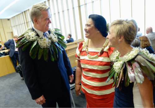 Francisco Kjolseth | The Salt Lake Tribune
John W. Huber and his wife Lori are presented with Tongan flower Lei's made by Sela Tauteoli, in honor of Huber's swearing in as U.S. Attorney at the new Federal Courthouse in Salt Lake City on Monday, Aug. 31, 2015.