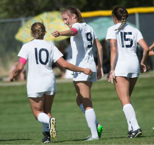 Steve Griffin  |  The Salt Lake Tribune

Skyline's Emma Heyn, center, is congratulated by her teammates after scoring a goal during the Skyline versus Murray girl's soccer game at Skyline High School in Salt Lake City, Tuesday, September 1, 2015.