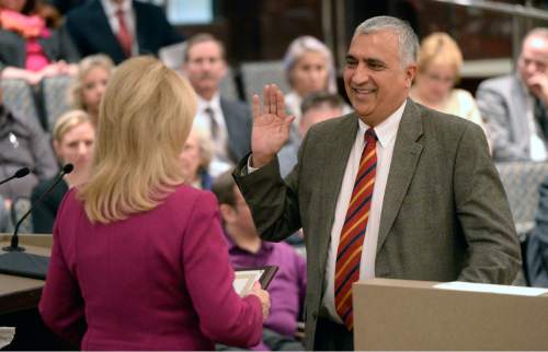 Al Hartmann  |  The Salt Lake Tribune
Oath of office is administered to Salt Lake County District Attorney Sim Gill at the Salt Lake County Council chamber Monday January 5.
