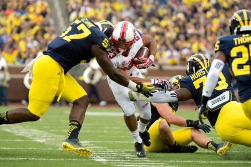 Jeremy Harmon  |  The Salt Lake Tribune

Utah's Devontae Booker (23) is tackled by Michigan's Frank Clark (57) as the Utes face the Wolverines in Ann Arbor, Saturday, Sept. 20, 2014.