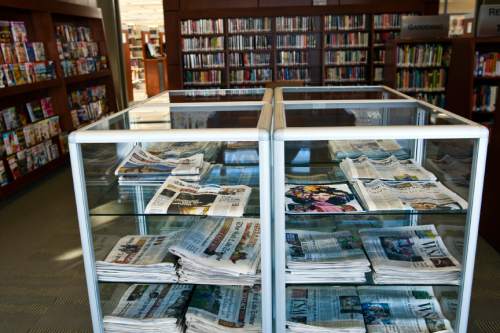 Chris Detrick  |  The Salt Lake Tribune

Newspaper racks at the Magna Library Thursday December 1, 2011.