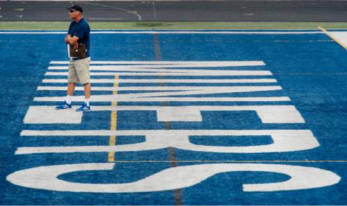Steve Griffin  |  The Salt Lake Tribune

Bingham High head football coach John Lambourne, stands in the end zone as he runs practice on the Bingham High School football field in South Jordan, Utah on Wednesday, August 26, 2015. Lambourne was named head coach following the retirement of Dave Peck and takes over one of the state's most successful football programs.