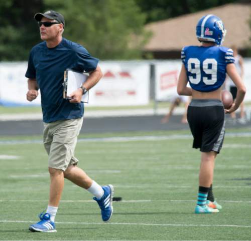 Steve Griffin  |  The Salt Lake Tribune

Bingham High head football coach John Lambourne, runs to the defensive unit as he runs practice on the Bingham High School football field in South Jordan, Utah on Wednesday, August 26, 2015. Lambourne was named head coach following the retirement of Dave Peck and takes over one of the state's most successful football programs.
