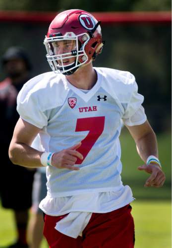 Steve Griffin  |  The Salt Lake Tribune

University of Utah quarterback Travis Wilson watches his pass downfield during first day of fall football camp at the University of Utah baseball field in Salt Lake City, Thursday, August 6, 2015.  l