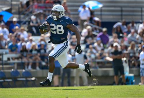 Scott Sommerdorf   |  The Salt Lake Tribune
BYU RB Adam Hine breaks away for a long TD against the #1 defensive unit during practice, Saturday, August 22, 2015.
