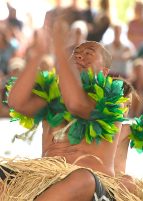 Leah Hogsten  |  The Salt Lake Tribune
Fiji Warrior Atu RokoBuludrau with the Halau 'O Ka'ipolani dance group performs a warrior dance at the Polynesian Days at Thanksgiving Point that showcases the cultures, foods, entertainment and diversities of the peoples of the Polynesian islands, September 5, 2015.