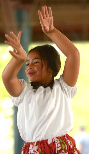 Leah Hogsten  |  The Salt Lake Tribune
Kailia Falo, 7, with the Halau 'O Ka'ipolani dance group performs at the Polynesian Days at Thanksgiving Point that showcases the cultures, foods, entertainment and diversities of the peoples of the Polynesian islands, September 5, 2015.