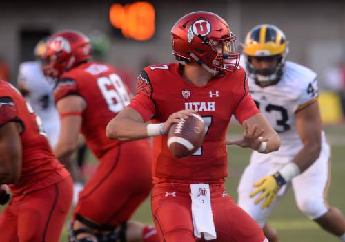 Francisco Kjolseth | The Salt Lake Tribune
Utah Utes quarterback Travis Wilson (7) looks for an open receiver while taking on the Michigan Wolverines in game action at Rice Eccles Stadium on Thursday, Sept. 3, 2015.