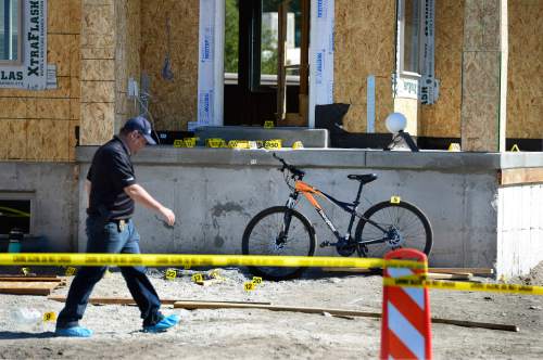 Scott Sommerdorf   |  The Salt Lake Tribune
Police investigate the scene of a homicide at a new home construction site at 527 E. Vine Street in Murray, Sunday, September 6, 2015.