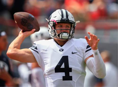 Brigham Young quarterback Taysom Hill (4) throws before an NCAA college football game against Nebraska in Lincoln, Neb., Saturday, Sept. 5, 2015. (AP Photo/Nati Harnik)