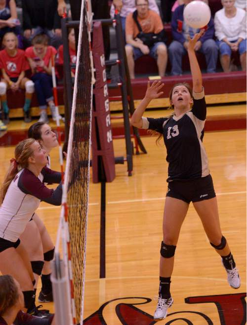 Leah Hogsten  |  The Salt Lake Tribune
Lone Peak's Jaysa Funk taps the ball over. Morgan High School girls volleyball hosts Lone Peak High, September 8, 2015.