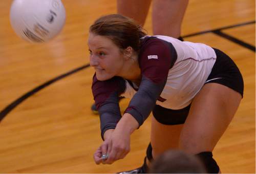 Leah Hogsten  |  The Salt Lake Tribune
Morgan's Jaiden Farr returns a volley. Morgan High School girls volleyball hosts Lone Peak High, September 8, 2015.