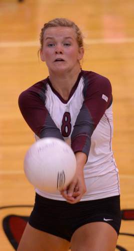 Leah Hogsten  |  The Salt Lake Tribune
Morgan's Aubrey Saunders returns a volley. Morgan High School girls volleyball hosts Lone Peak High, September 8, 2015.