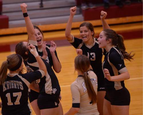 Leah Hogsten  |  The Salt Lake Tribune
Lone Peak celebrates an ace. Morgan High School girls volleyball hosts Lone Peak High, September 8, 2015.