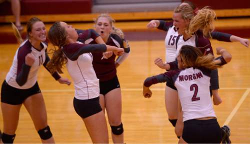 Leah Hogsten  |  The Salt Lake Tribune
Morgan celebrates an ace serve. Morgan High School girls volleyball hosts Lone Peak High, September 8, 2015.