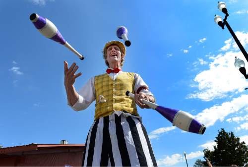 Scott Sommerdorf   |  The Salt Lake Tribune
"Leapin' Louie" juggles on stilts during the final day of the Utah State Fair, Sunday, Sept. 14, 2014.