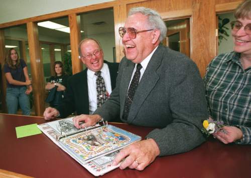 Al Hartmann  |  The Salt Lake Tribune

Hal Edwards, editor of The Richfield Reaper for more than 40 years, enjoys a hearty laugh with the then-Publisher Mark Fullenbach  (left and behind) and some newspaper staff members in 1998 as he looks through a scrapbook of memories of his years at the job.