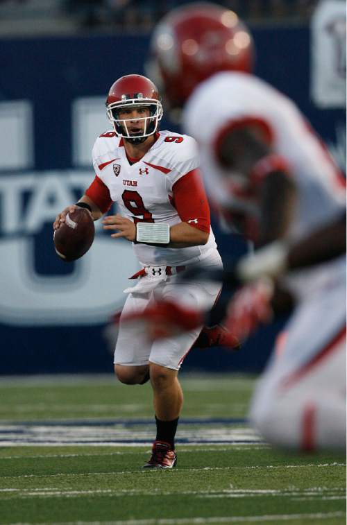 Scott Sommerdorf  |  The Salt Lake Tribune 
            
Utah QB Jon Hays looks for an open receiver late in the first half. The USU Aggies held a 13-3 lead over Utah at the half, Friday, September 7, 2012.