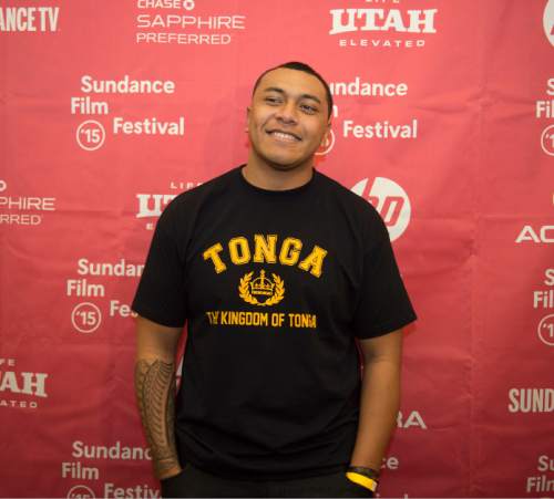 Steve Griffin  |  The Salt Lake Tribune

Fihi Kaufusi, who played football for Highland High School in Salt Lake City, smiles as he walks the press line as he attends the Sundance premiere of ÏIn Football We TrustÓ  at the Salt Lake Community CollegeÌs The Grand Theatre , in Salt Lake City, Friday, January 23, 2015. The documentary follows four teen boys, Harvey Langi, Leva Bloomfield, Vita Bloomfield and Kaufusi, from UtahÌs Pacific Islander community as they navigate the world of high-school football. The boys deal with such issues as extreme poverty, gang influence and family pressures to succeed on the field.