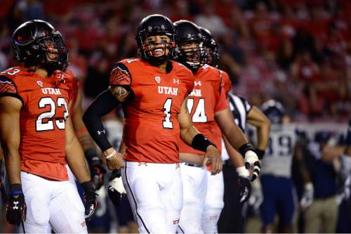 Scott Sommerdorf   |  The Salt Lake Tribune
Utah QB Kendal Thompson took over for the injured Travis Wilson, and finished 8 for 10 passes and 56 yards. Utah beat Utah State 24-14 at Rice-Eccles, Friday, September 11, 2015.