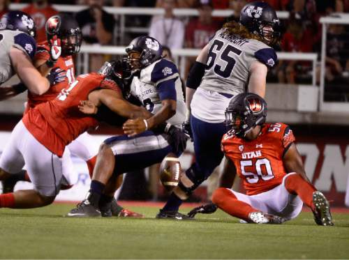Scott Sommerdorf   |  The Salt Lake Tribune
Utah forced this fumble from USU QB Chuckie Keeton but somehow didn't recover it during fourth quarter play. Utah beat Utah State 24-14 at Rice-Eccles, Friday, September 11, 2015.