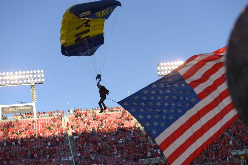 Leah Hogsten  |  The Salt Lake Tribune
The U. S. Navy Parachute Team the Leap Frog enter the stadium with a giant American Flag on behalf of 9-11 Remembrance. University of Utah hosts Utah State at Rice-Eccles Stadium, Friday, September 11, 2015.