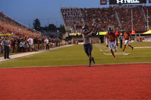 Leah Hogsten  |  The Salt Lake Tribune
Utah State Aggies running back LaJuan Hunt (21) makes a touchdown. University of Utah is tied with Utah State 14-14 at halftime at Rice-Eccles Stadium, Friday, September 11, 2015.