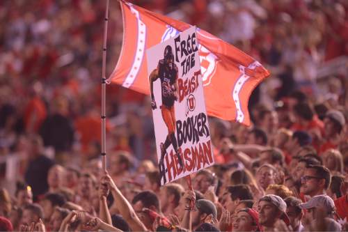 Leah Hogsten  |  The Salt Lake Tribune
Utah Utes running back Devontae Booker (23) has fans in the crowd. University of Utah is tied with Utah State 14-14 at halftime at Rice-Eccles Stadium, Friday, September 11, 2015.