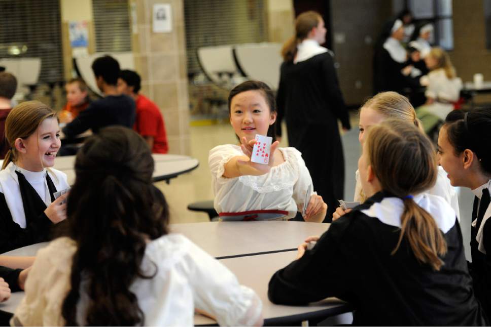 Sarah A. Miller  |  The Salt Lake Tribune

Jean Noh, 12, plays a card game with other ensemble members to pass time before the 7 p.m. performance of The Sound of Music Friday evening March 11, 2011 at Clayton Middle School.