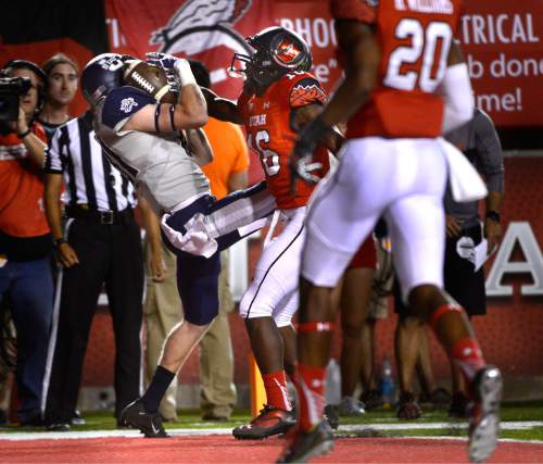 Scott Sommerdorf   |  The Salt Lake Tribune
Utah State Aggies running back LaJuan Hunt (21) catches an 8 yard TD pass from QB Chuckie Keeton to give USU a 7-7 tie during first half play. Utah and Utah State were tied 14-14 at the half at Rice-Eccles, Friday, September 11, 2015.