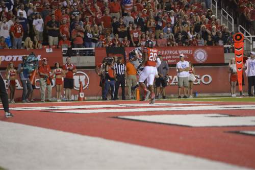 Leah Hogsten  |  The Salt Lake Tribune
Utah State Aggies Zach Van Leeuwen catches the pass in the final minute of the 2nd quarter for a touchdown. University of Utah is tied with Utah State 14-14 at halftime at Rice-Eccles Stadium, Friday, September 11, 2015.