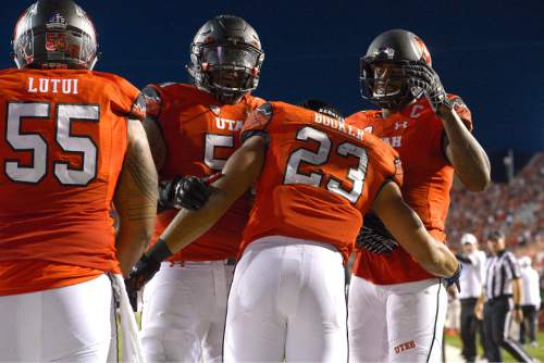 Leah Hogsten  |  The Salt Lake Tribune
Utah Utes running back Devontae Booker (23) celebrates after his touchdown. University of Utah is tied with Utah State 14-14 at halftime at Rice-Eccles Stadium, Friday, September 11, 2015.