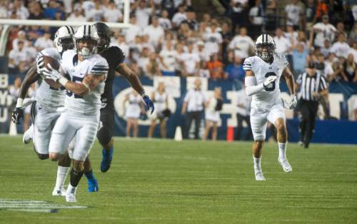 Rick Egan  |  The Salt Lake Tribune


Brigham Young Cougars wide receiver Mitchell Juergens (87) runs for a touchdown after catching a long bomb, give BYU a 7-0 on their first possession, in college football action, BYU vs. Boise State at Lavell Edwards Stadium, Saturday, Sept. 12, 2015.