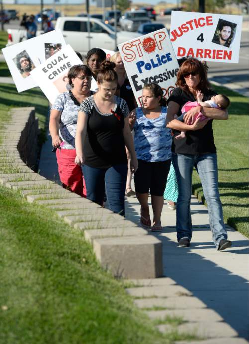 Francisco Kjolseth | The Salt Lake Tribune
Susan Hunt, right, is joined by family, friends and supporters on the one-year anniversary of the death of her son Darrien Hunt at the hands of police in Saratoga Springs.