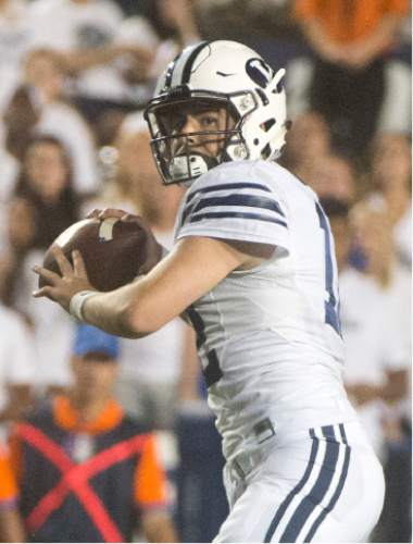 Rick Egan  |  The Salt Lake Tribune

 Brigham Young Cougars quarterback Tanner Mangum (12) loos for an open man, in college football action, BYU vs. Boise State at Lavell Edwards Stadium, Saturday, September 12, 2015.