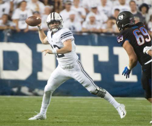 Rick Egan  |  The Salt Lake Tribune

Brigham Young Cougars quarterback Tanner Mangum (12) throws the ball, in college football action, BYU vs. Boise State at Lavell Edwards Stadium, Saturday, Sept. 12, 2015.