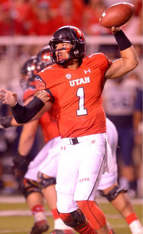 Leah Hogsten  |  The Salt Lake Tribune
Utah Utes quarterback Kendal Thompson (1) runs out of the pocket. University of Utah is tied with Utah State 14-14 at halftime at Rice-Eccles Stadium, Friday, September 11, 2015.