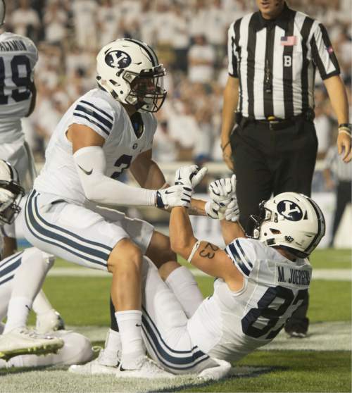 Rick Egan  |  The Salt Lake Tribune


Brigham Young Cougars Brigham Young Cougars wide receiver Colby Pearson (3) celebrates the touchdown by Mitchell Juergens (87) after Juergens caught a long bomb, give BYU a 7-0 on their first possession, in college football action, BYU vs. Boise State at Lavell Edwards Stadium, Saturday, Sept. 12, 2015.