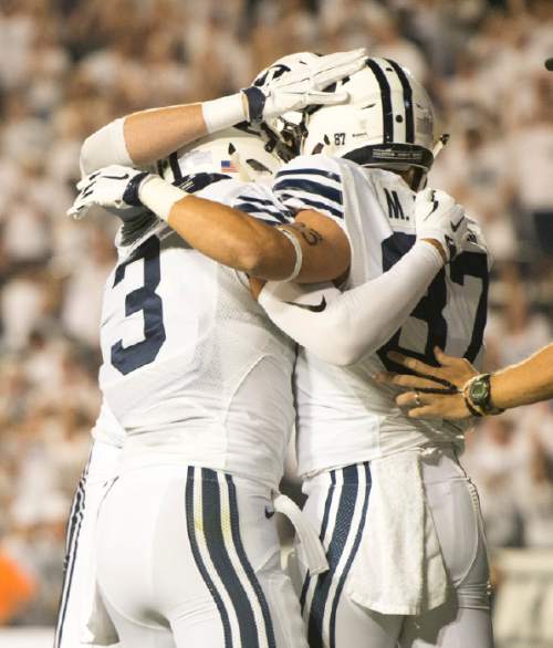 Rick Egan  |  The Salt Lake Tribune


Brigham Young Cougars celebrate the touchdown by Mitchell Juergens (87) after catching a long bomb, give BYU a 7-0 on their first possession, in college football action, BYU vs. Boise State at Lavell Edwards Stadium, Saturday, Sept. 12, 2015.