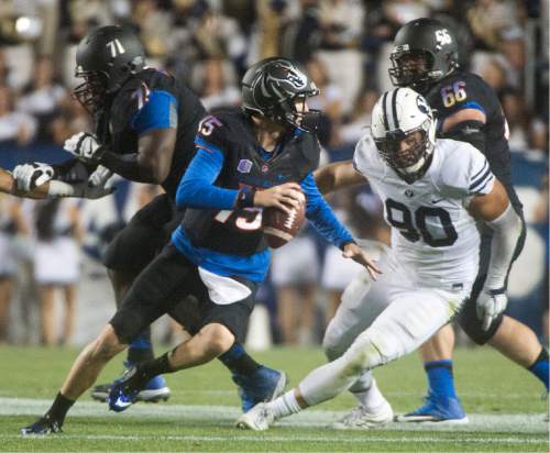 Rick Egan  |  The Salt Lake Tribune

Boise State Broncos quarterback Ryan Finley (15), scrambles to get away from Brigham Young Cougars defensive lineman Bronson Kaufusi (90), in college football action, BYU vs. Boise State at Lavell Edwards Stadium, Saturday, September 12, 2015.