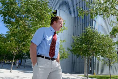 Scott Sommerdorf   |  Tribune file photo
Jeremy Johnson leaves the federal courthouse after a hearing in July.